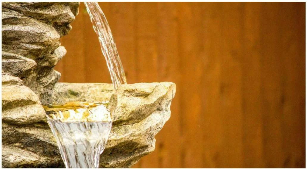 Water cascading down rocks water feature